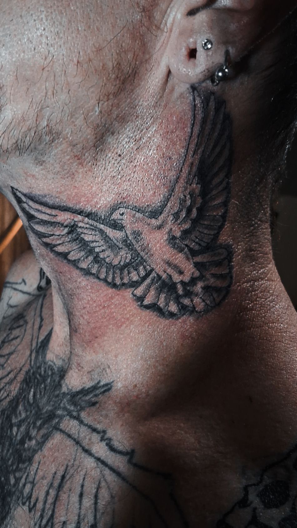 Detailed dove neck tattoo