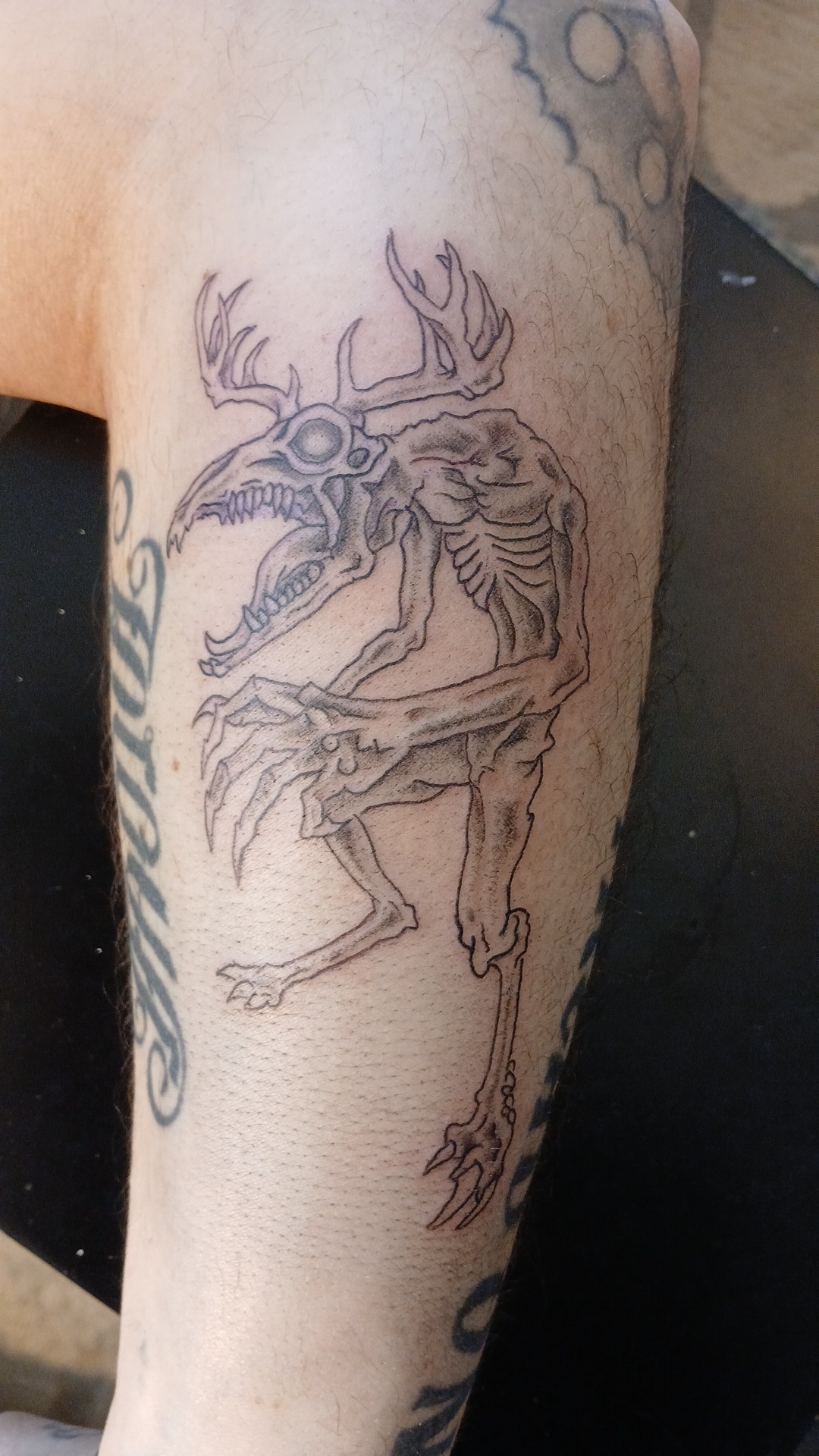 Wendigo linework leg tattoo