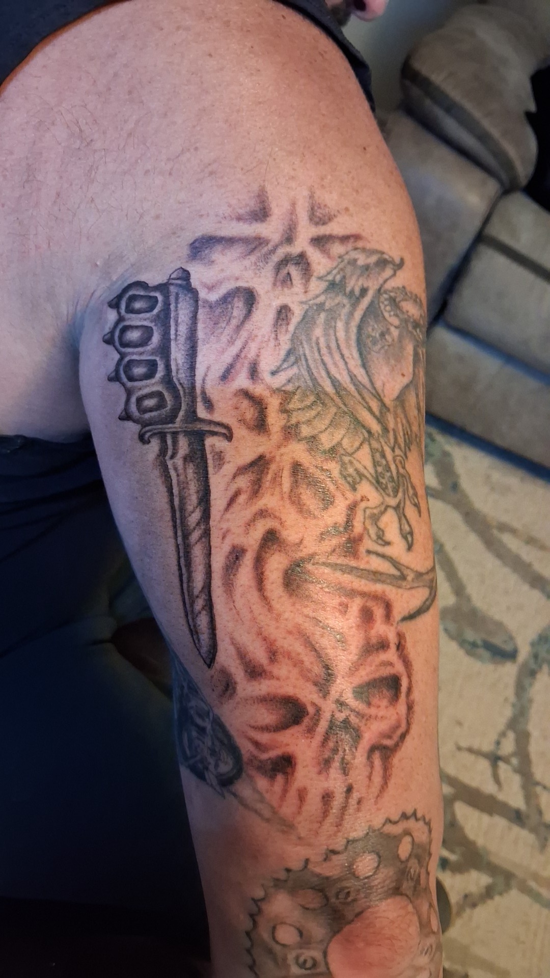 Dagger, brass knuckles, skulls and eagle arm sleeve