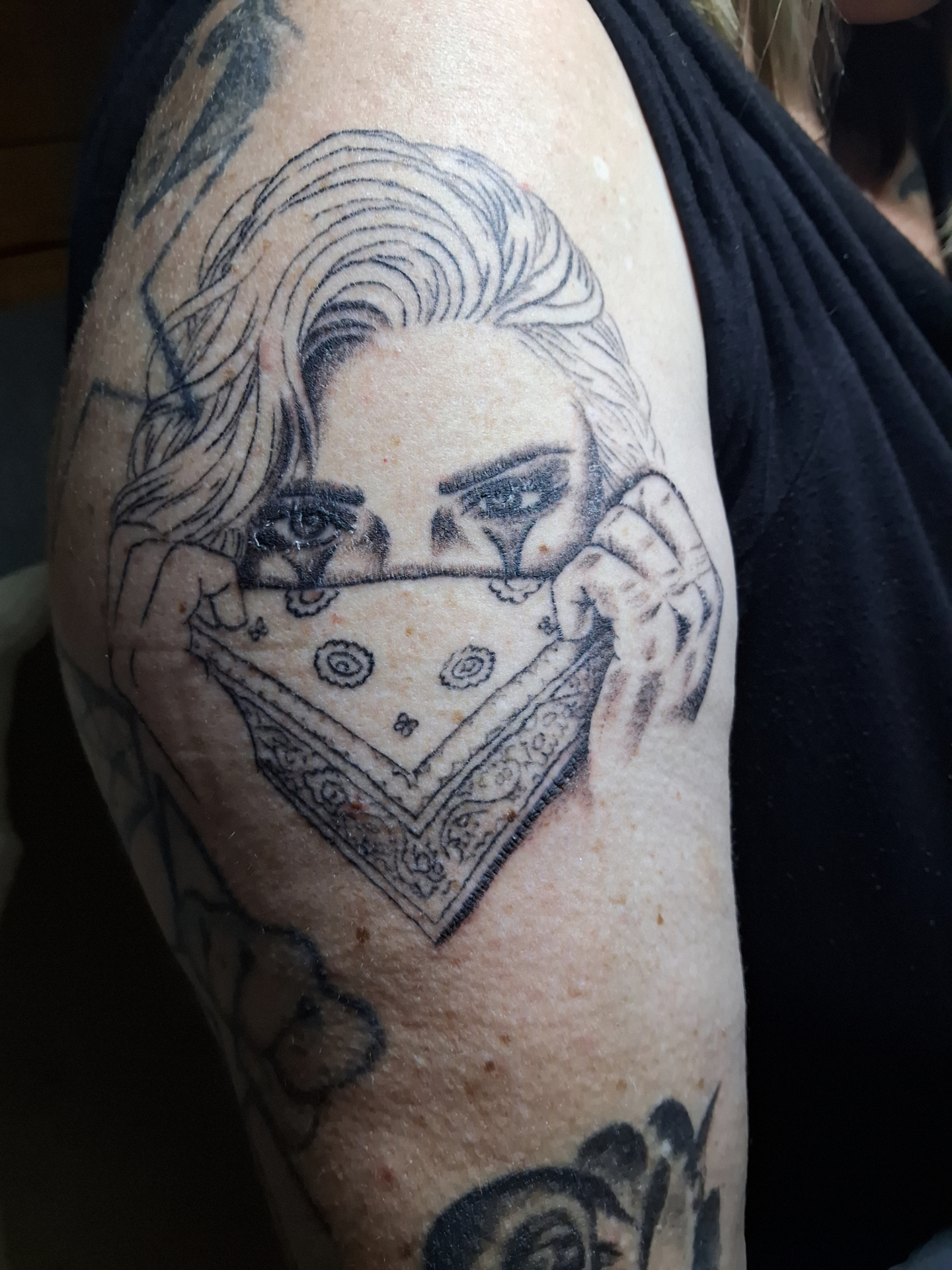 Bandana girl shoulder tattoo linework