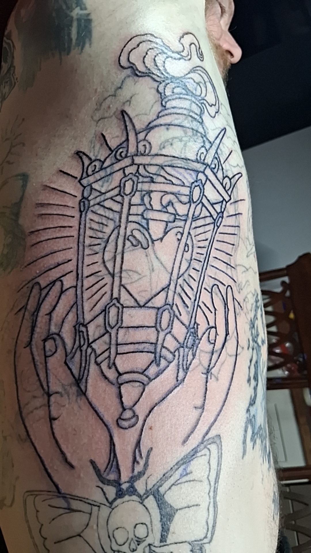 Lantern held by hands sleeve linework