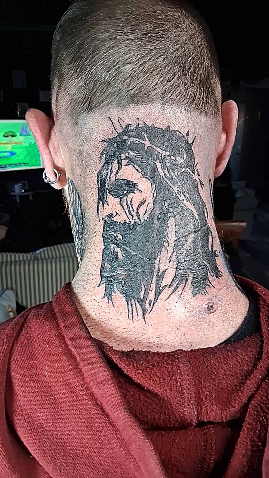 Jesus with crown of thorns back-of-head tattoo